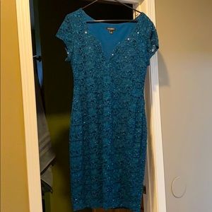 A size 14 teal in color dress